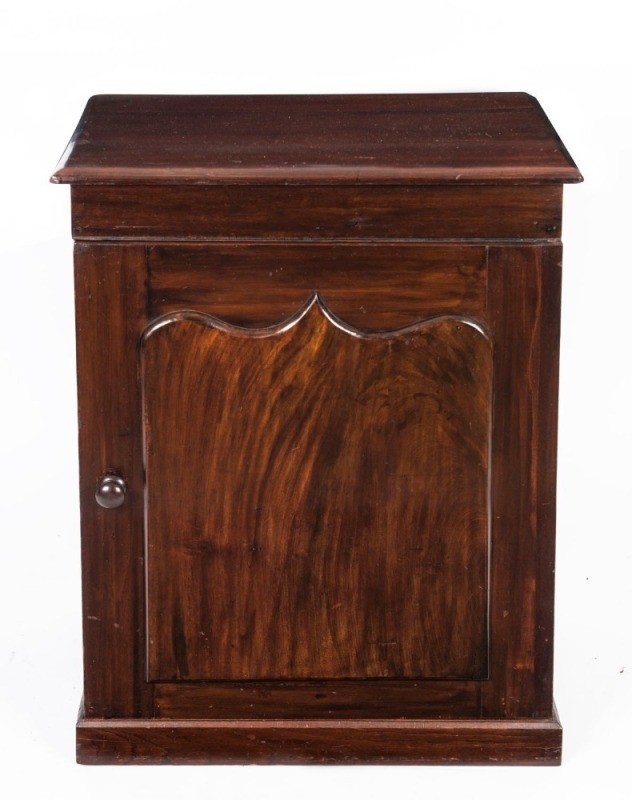 An Australian cedar cupboard with a shield panelled door and a plinth base, 19th century, 83cm high, 65cm wide, 44cm deep