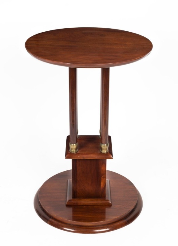 An Australian blackwood pedestal occasional table, circular top and conforming base with four pillars and brass sabots, circa 1910, 74.5cm high, 51cm diameter