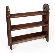 An Australian blackwood Arts & Crafts centre shelf unit with pierced sides and a trough base, circa 1920, ​​​​​​​75.5cm high, 76cm wide, 21.5cm deep