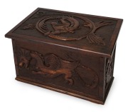 An Australian blackwood fuel box with sloping lift-top, four carved griffin panels and makers ink stamp "J. Fraser, Hyde St. Sth Adelaide", early 20th century, ​​​​​​​48.5cm high, 65cm wide, 40.5cm deep