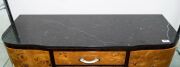 An Austrian Art Deco sideboard,&nbsp;Karelian birch and macassar ebony with black marble top and ivorine handles, circa 1925, 93cm high, 107cm wide, 37cm deep - 2