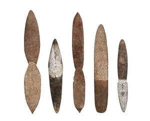 BULLROARERS: Fine group of 5 carved wooden bullroarers. Papua New Guinea, mid 20th century. Varying sizes 37cm to 52cm