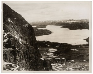 THE B.A.N.Z. ANTARCTIC EXPEDITION: Official original photograph by Captain Frank Hurley: Image A7 - Title: The lonely solitude of Kerguelen, with official "MAWSON ANTARCTIC EXPEDITION" handstamp and release date "THURSDAY FEB.13, 1930" verso, together wit