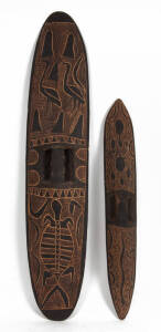 SHIELDS: Two West Australian (Kimberly region) aboriginal shields with carved decoration, c1970s. 75cm & 104cm