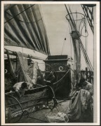 THE B.A.N.Z. ANTARCTIC EXPEDITION: Official original photograph by Captain Frank Hurley: Image A30 - Title: Overhauling the Gear, with official "MAWSON ANTARCTIC EXPEDITION" handstamp and release date "TUESDAY APR.15, 1930" verso, together with official p