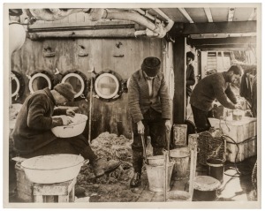 THE B.A.N.Z. ANTARCTIC EXPEDITION: Official original photograph by Captain Frank Hurley: Image A38 - Title: Solving Secrets of Antarctic Depths, with official "MAWSON ANTARCTIC EXPEDITION" handstamp and release date "TUESDAY APR.15, 1930" verso, together 