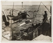 THE B.A.N.Z. ANTARCTIC EXPEDITION: Official original photograph by Captain Frank Hurley: Image A51 - Title: Off on a Flight of Exploration, with official "MAWSON ANTARCTIC EXPEDITION" handstamp and release date "TUESDAY MAY 6, 1930" verso, together with o