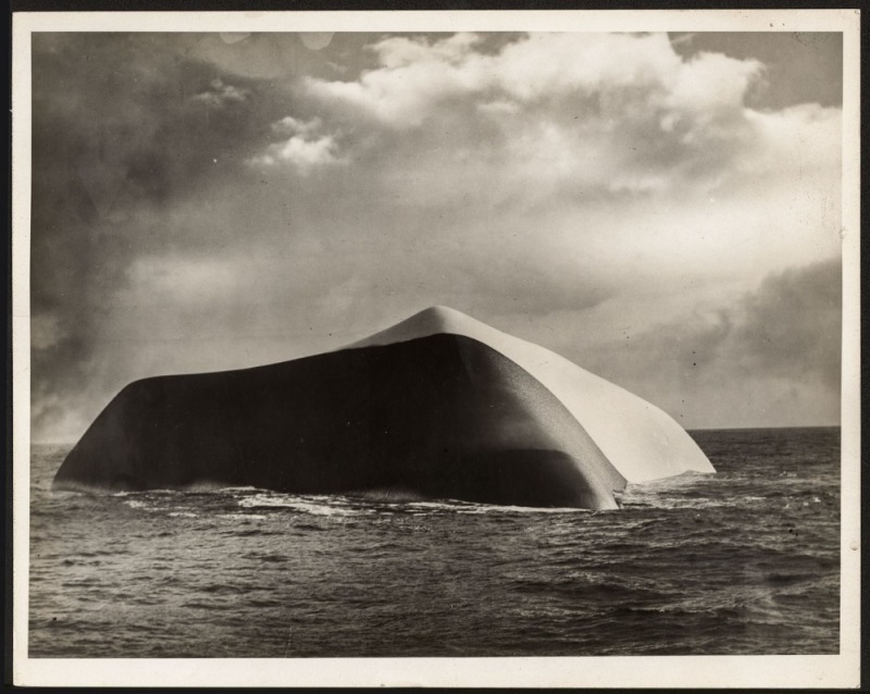 THE B.A.N.Z. ANTARCTIC EXPEDITION: Official original photograph by Captain Frank Hurley: Image A73 - Title: An Anomaly in Icebergs, with official "MAWSON ANTARCTIC EXPEDITION" handstamp and release date "TUESDAY MAY 27, 1930" verso, together with official