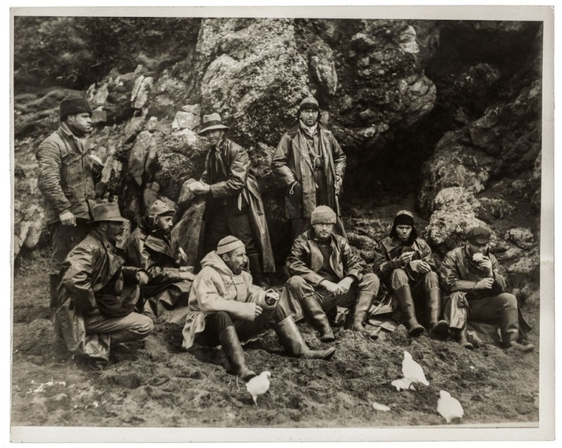 THE B.A.N.Z. ANTARCTIC EXPEDITION: Official original photo by Captain Frank Hurley: Image A4 - Title: A mid-day snack in the field, with official "MAWSON ANTARCTIC EXPEDITION" handstamp and release date "THURSDAY FEB.13, 1930" verso, together with the off