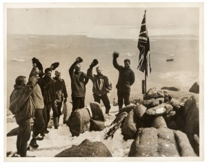 THE B.A.N.Z. ANTARCTIC EXPEDITION: Official original photograph by Captain Frank Hurley: Image A42 - Title: Cheering the Flag. with official "MAWSON ANTARCTIC EXPEDITION" handstamp and release date "MONDAY APR. 28, 1930" verso, together with the official 