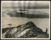 THE B.A.N.Z. ANTARCTIC EXPEDITION: Official original photograph by Captain Frank Hurley: Image A63 - Title: In a land of blue and silver. with official "MAWSON ANTARCTIC EXPEDITION" handstamp and release date "MONDAY MAY 12, 1930" verso, together with off