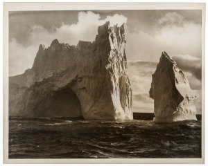 THE B.A.N.Z. ANTARCTIC EXPEDITION: Official original photograph by Captain Frank Hurley: Image A78 - Title: A dazzling sentinel on the threshold of MacRobertson Land. with official "MAWSON ANTARCTIC EXPEDITION" handstamp and release date "TUESDAY MAY 27, 