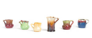 REMUED: Group of 6 pottery jugs with branch handles, circa mid 1930s. Various sizes. Heights 7.5cm to 13cm