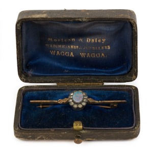 MORISON & DALEY of Wagga Wagga, antique 9ct yellow gold bar brooch, set with an opal doublet surrounded by white diamonds, in original retailer's plush fitted box, 19th/20th century, 5.5cm wide, 3.3 grams