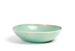 KLYTIE PATE: Green glazed pottery fruit bowl, incised signature. Width 22cm, height 5.5cm