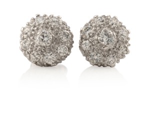 A pair of white gold and diamond cluster earrings