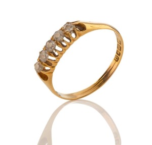 An antique 18ct yellow gold ring, set with a row of five rose cut diamonds, 19th century, ​​​​​​​2.4 grams total