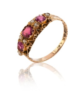 An antique 9ct yellow gold ring, set with seed pearls and red stones, circa 1880, 1.3 grams total
