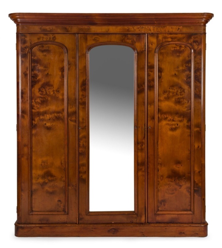 An antique Australian huon pine three door wardrobe, Melbourne origin, circa 1880. Well selected huon pine veneers, and handsomely fitted interior. ​​​​​​​210cm high, 192cm wide, 53cm deep