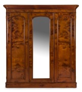 An antique Australian huon pine three door wardrobe, Melbourne origin, circa 1880. Well selected huon pine veneers, and handsomely fitted interior. ​​​​​​​210cm high, 192cm wide, 53cm deep