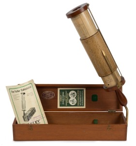  A FULLER'S SPIRAL CYLINDRICAL SLIDE RULE CALCULATOR Stanley & Co., London, circa 1920s. A 17 inch (44.5cm) long hand-held cylindrical slide rule calculator, No 7906, with sliding drum scales, lacquered brass reading bar, mahogany caps and handle. Housed 