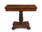 An impressive Colonial Australian cedar fold-over card table. Handsomely crafted in choice cuts of cedar with cross banded edge, cross grained ogee moulded frieze, finely carved and turned column, platform base and scrolling feet, Tasmanian origin, circa