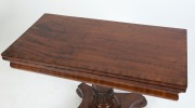 An impressive Colonial Australian cedar fold-over card table. Handsomely crafted in choice cuts of cedar with cross banded edge, cross grained ogee moulded frieze, finely carved and turned column, platform base and scrolling feet, Tasmanian origin, circa - 7