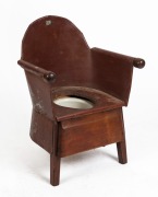  An antique Australian Child's commode chair, tin and ash wood construction with burnt ochre painted finish. Circa 1920, 68cm high, 52cm across the arms.