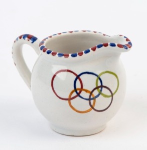 1960 ROME OLYMPICS: small ceramic cream jug showing Olympics Rings and a stylized javelin thrower, marked 'Italy, '62' on base, height 6cm.