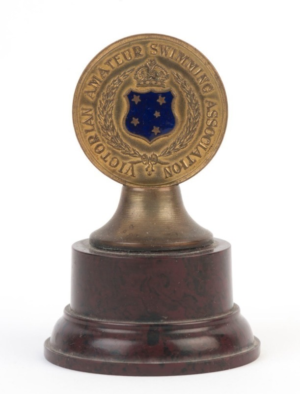 SWIMMING: 1935-36 Victorian Amateur Swimming Association trophy, with bakelite base, awarded to "R. Snell" for 1st position in the '100 Yds Junior Backstroke' at the Victoria Championships; height 8.5cm.