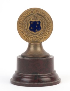 SWIMMING: 1935-36 Victorian Amateur Swimming Association trophy, with bakelite base, awarded to "R. Snell" for 1st position in the '100 Yds Junior Backstroke' at the Victoria Championships; height 8.5cm.