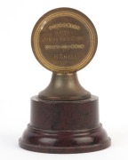 SWIMMING: 1935-36 Victorian Amateur Swimming Association trophy, with bakelite base, awarded to "R. Snell" for 1st position in the '100 Yds Junior Backstroke' at the Victoria Championships; height 8.5cm. - 2