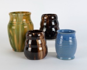 Four assorted Australian pottery vases, comprising a pair of brown glazed examples, a blue and a green example, ​​​​​​​the largest 17cm high