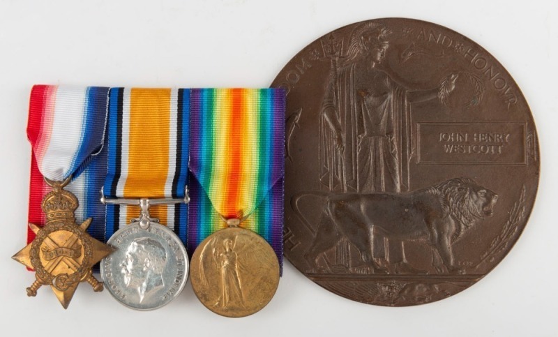 WWI BRONZE MEMORIAL PLAQUE (Death Penny): inscribed 'He Died for Freedom and Honour', in the name of 'JOHN HENRY WESTCOTT', and issued to his next of kin, blank on reverse, 120cm diameter; together with his trio of medals: 1914-15 Star, unnamed; 1914-18 B