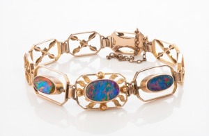 JOSEPH LAWRENCE (Melbourne), 9ct gold bracelet, set with three black opal doublets, early 20th century, stamped "9" with pictorial mark, ​​​​​​​11.5 grams total