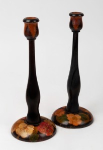 A pair of pokerwork candlesticks with floral decorations, early 20th century,  ​​​​​​​29.5cm high