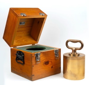 A 56lb. official Government weight in box, stamped "GV, 88,", "STANDARD" with crown. ​​​​​​​the box 32cm high