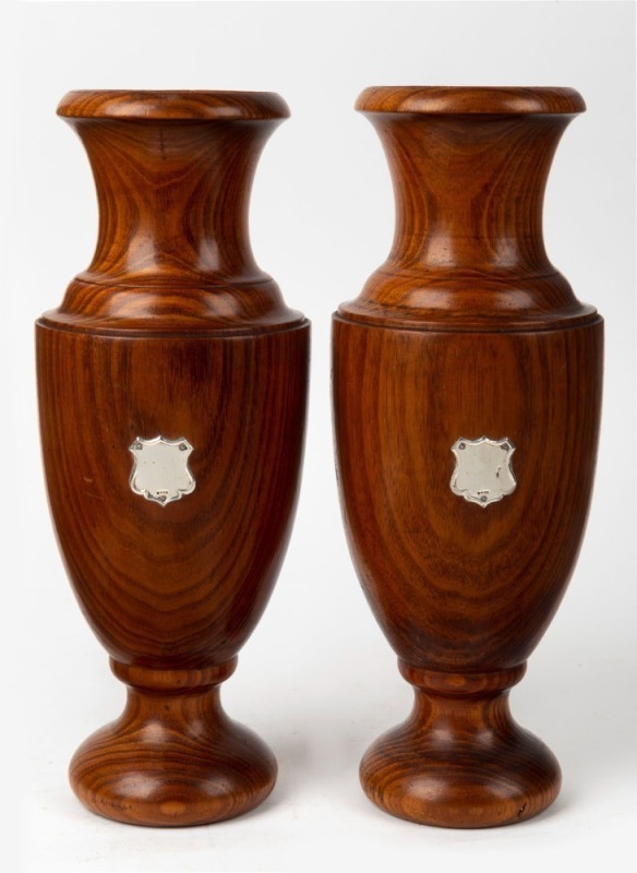 A pair of Tasmanian blackwood mantle urns with sterling silver shields, 19th/20th century, 30.5cm high