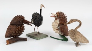 Four assorted Folk Art  hand-painted pine cone bird ornaments including two kookaburras, a swan and an emu, circa 1920, the largest 18.5cm high