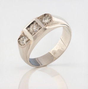 A platinum ring, set with three brilliant cut white diamonds, ​​​​​​​8.8 grams total