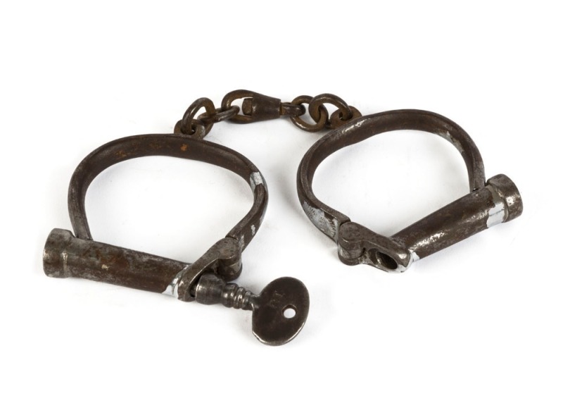 HIATT antique handcuffs with key and remains of nickel plated finish, stamped "Hiatt Best, Warranted Wrought", 19th century, 23cm wide