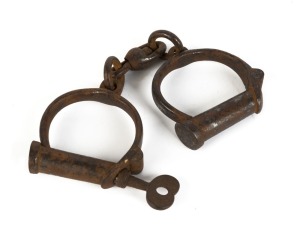 Early convict handcuffs, screw key type, stamped "Hard, 2", early 19th century, ​​​​​​​23cm wide