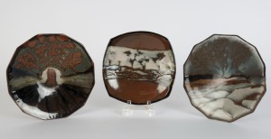 TREVOR HANBY three studio pottery landscape platters, ​​​​​​​the largest 24cm wide