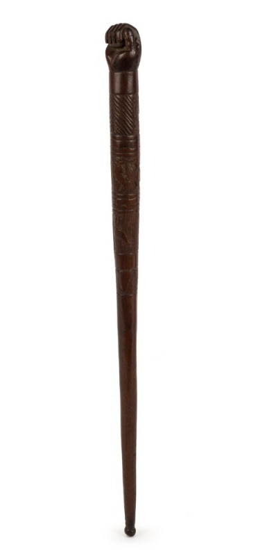 An antique Australian stock whip handle with fist finial, carved with emus and kangaroo, 19th century, 42cm long