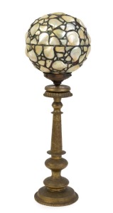 A Middle Eastern brass table lamp base with Arts & Crafts pearl shell and glass shade, 77cm high