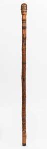 An antique Japanese bamboo rootstock walking stick with carved Samurai scene and brass ferrule, Meiji period, 90cm high