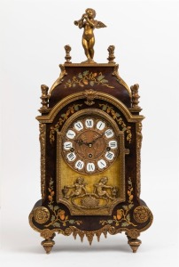 A German mantle clock in the French style with decorative walnut case, figural decoration and Roman numerals, 20th century, 56cm high