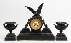 An antique French three piece clock set in black slate and green marble case adorned with a bronze eagle and serpent, eight day time and strike movement, Arabic numerals and accompanying urn garnitures with bronze mounts, 19th century, 54cm high