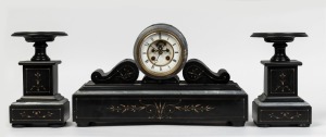 An antique French three piece clock set in black slate and grey marble case with eight day time and strike movement, open escapement, Roman numerals and urn garnitures, 19th century, 26cm high, 44cm wide