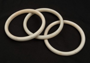 Three kina shell money rings, Papua New Guinea,  9.5cm diameter